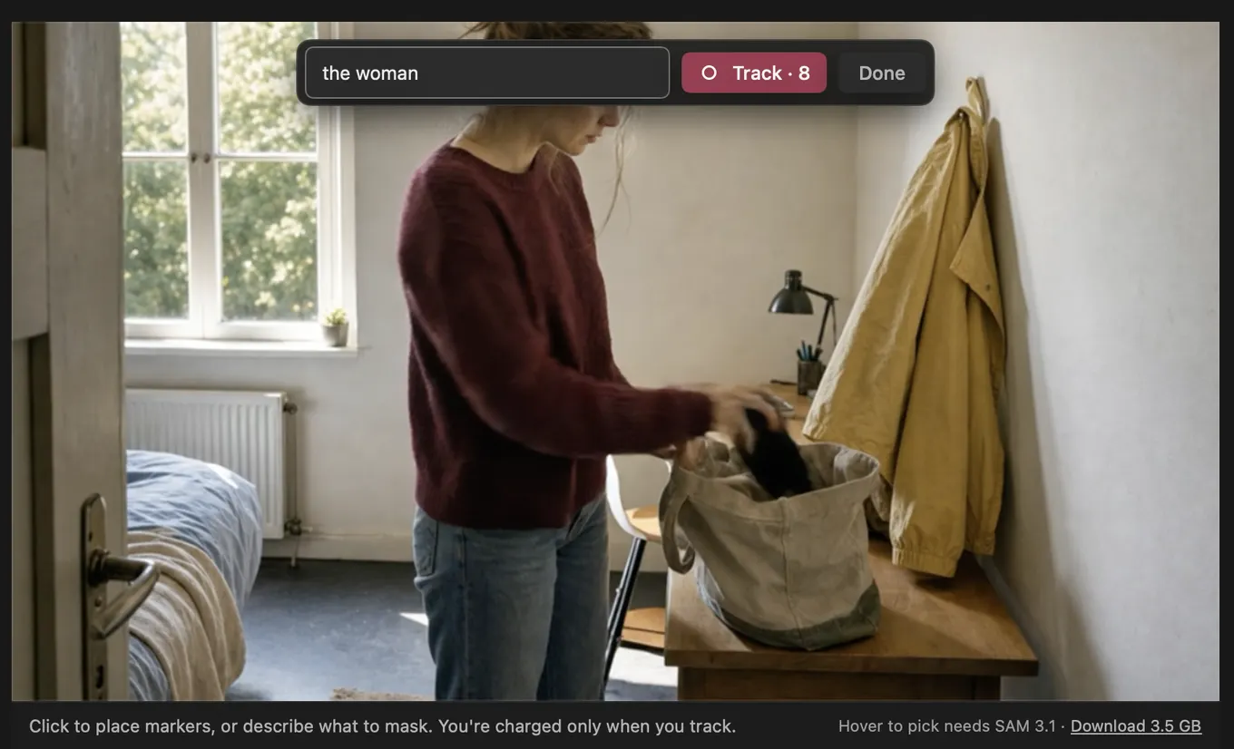 The Cask Film viewer in mask mode, with "the woman" typed into the describe field above a woman packing a bag in a bedroom